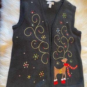 Black knitted vest with Christmas embroidery.